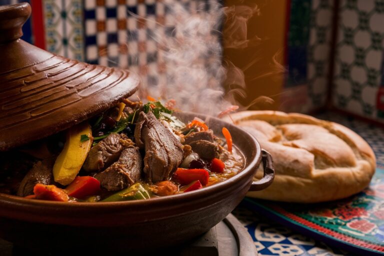 A beautifully served Moroccan Tajine with tender meat, vegetables, and aromatic spices.